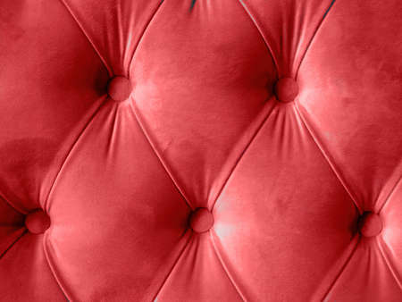 Velor lime surface of sofa close-up. Training equipment-velor mats tightened with buttons. Red chesterfield style quilted upholstery backgroundの写真素材