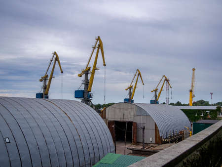 Vyborg seaport, cranes, unloading coal into wagonsの写真素材