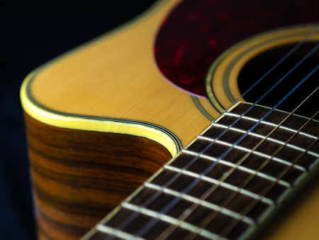 six - string acoustic guitar on a black background. low key. music dayの写真素材