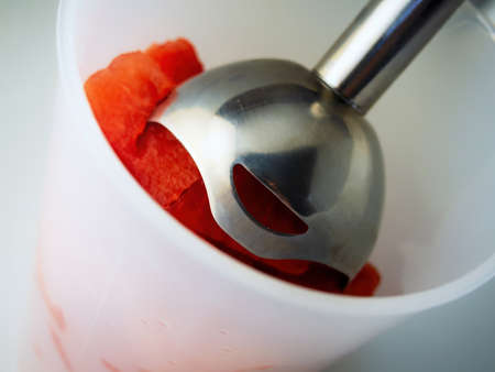 Roads of fresh watermelon in a bowl with a blender. Cooking fresh delicious watermelon smoothie.の写真素材