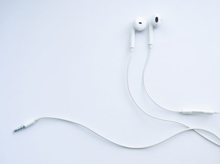White wired headphones, headset on a white background. Musical dayの写真素材