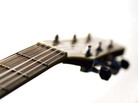 six - string acoustic guitar on a white background. music day