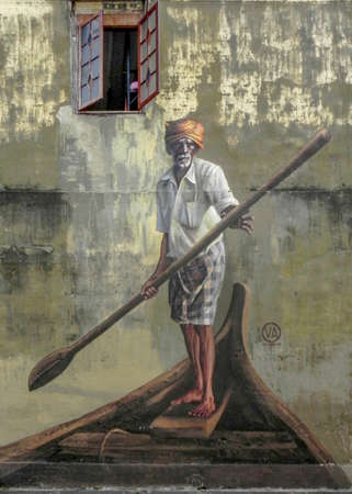 PENANG, MALAYSIA-2014-01-08 : Public street art in Georgetown "Old man with a paddle on a boat", Penang, Malaysiaのeditorial素材