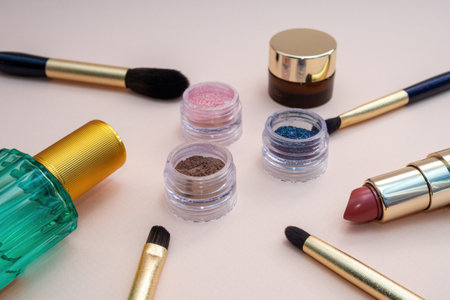 set of beauty cosmetics for female face and eye makeup on pink background . photoの写真素材