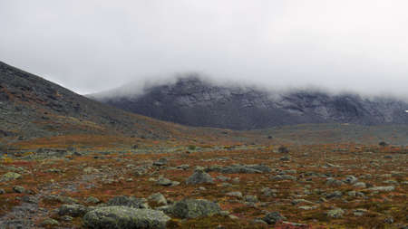 The clouds caught on the tops of the mountains. Low clouds in the mountains. Khibiny, Russia. photoの写真素材