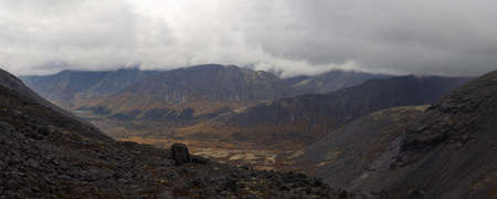 The clouds caught on the tops of the mountains. Low clouds in the mountains. Khibiny, Russia. photoの写真素材