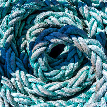 Close-up of an old frayed boat rope as a nautical backgroundの写真素材