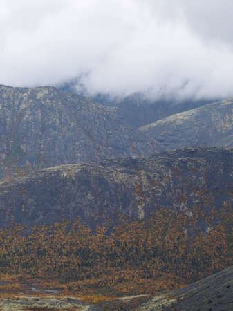 The clouds caught on the tops of the mountains. Low clouds in the mountains. Khibiny, Russia. photoの写真素材