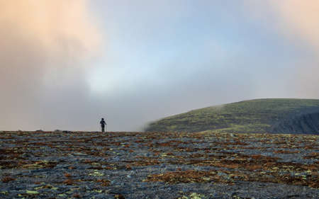 Autumn colorful tundra on the background mountain peaks in cloudy weather. Mountain landscape in Kola Peninsula, Arctic, Khibiny Mountains. photoの写真素材