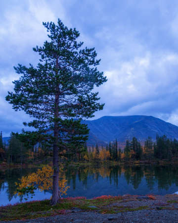 Reflection of mountains and clouds in the calm surface of the lake. peaceful landscape. Khibiny. photoの写真素材