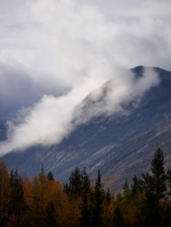 The clouds caught on the tops of the mountains. Low clouds in the mountains. Khibiny, Russia.の写真素材