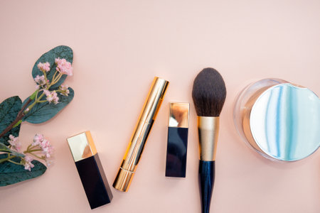 set of beauty cosmetics for female face and eye makeup on pink background . photoの写真素材