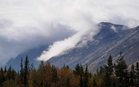 The clouds caught on the tops of the mountains. Low clouds in the mountains. Khibiny, Russia. photoの写真素材