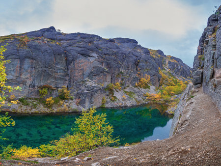 Emerald lake in the Khibiny mountains. Lake with emerald water and rocky shores. photoの写真素材