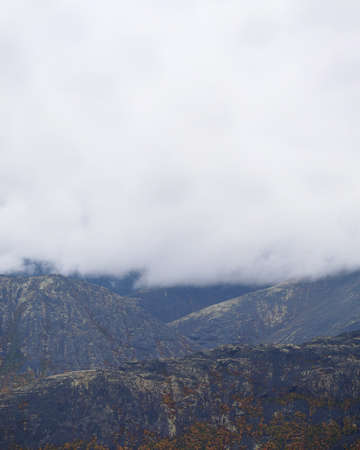The clouds caught on the tops of the mountains. Low clouds in the mountains. Khibiny, Russia. photoの写真素材