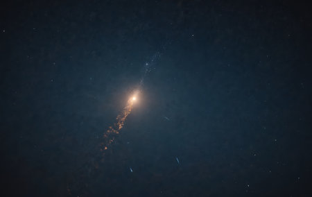 Astronomical object resembling a galaxy with electric blue hues against a midnight sky, featuring lens flare and cumulus clouds in deep spaceの素材