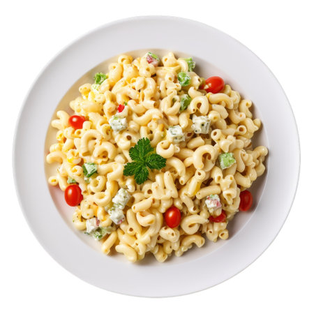 A plate of pasta featuring curly macaroni mixed with cherry tomatoes, herbs, and vegetables. The dish looks vibrant and appetizing, perfect for a light meal or side dish.の素材