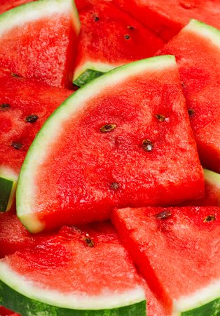 slices of watermelon on the table backgroundの写真素材