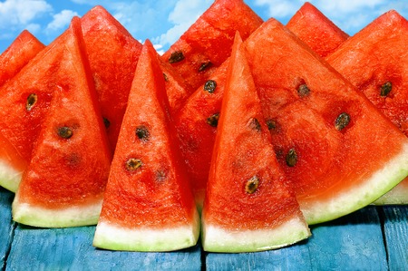 slices of watermelon on the table backgroundの写真素材