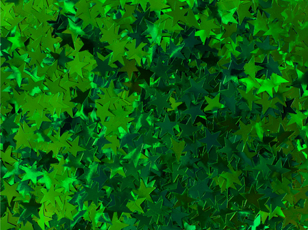 shiny shimmering holiday stars background close upの写真素材