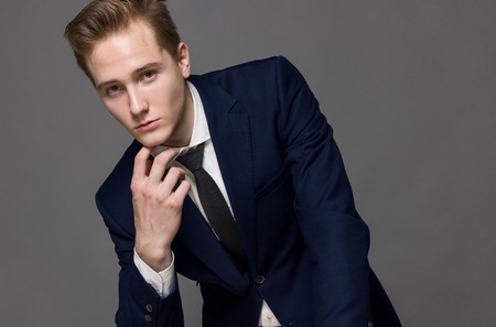 Elegant young handsome man. Studio fashion portrait.の写真素材