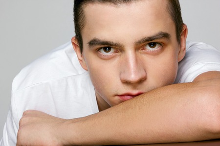 portrait of a young man in a white t-shirt close-upの写真素材
