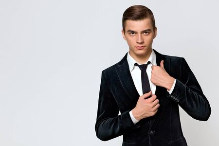 young man model in a fashionable suit and tie, studioの写真素材