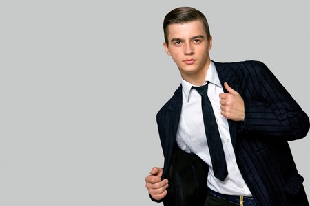 young man model in a fashionable suit and tie, studioの写真素材