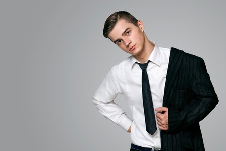 a young man in a fashionable suitの写真素材