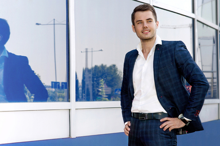 Fashion portrait of an handsome businessman in an urban settingの写真素材