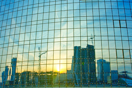 Modern building reflected in windowsの写真素材