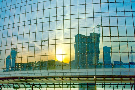 Modern building reflected in windowsの写真素材