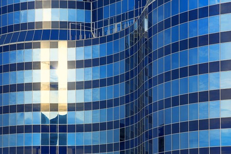 modern facade of the building, illuminated sunの写真素材