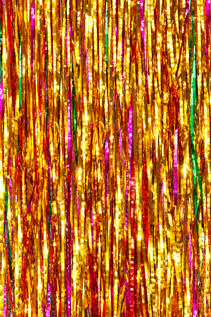 Colorful tinsel. Christmas blurred backgroundの写真素材