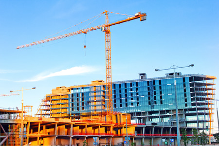 Tower crane builds a large residential buildingの写真素材