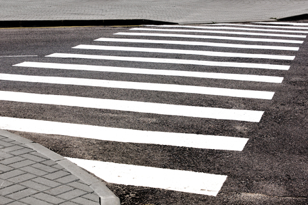 Road marking transition white on asphaltの写真素材