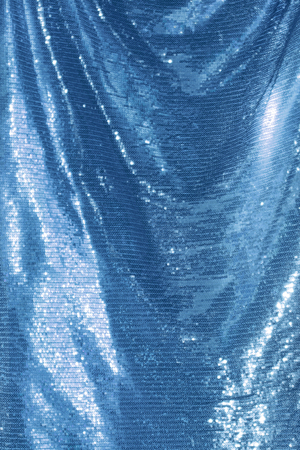 Abstract blinking background indigo, ultramarine . Fabric texture with spanglesの写真素材