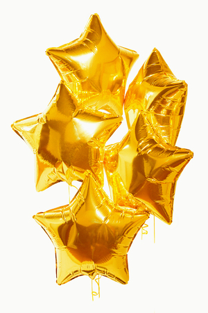 festive golden star balls on white backgroundの写真素材