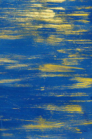 gold paint on a blue backgroundの写真素材