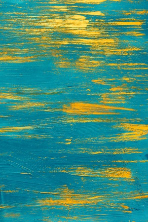 gold paint on a blue backgroundの写真素材