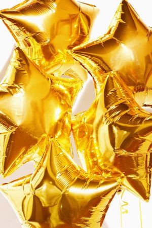golden balloon star on a white backgroundの写真素材