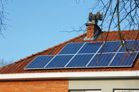 solar panels on a tiled roofの写真素材