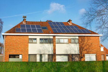 solar panels on a tiled roofの写真素材