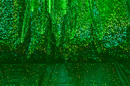 green shiny overflowing draperyの写真素材