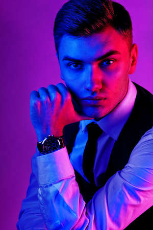 Portrait of a male model in a red-blue toneの写真素材