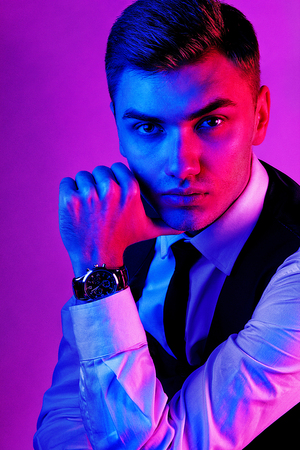 Portrait of a male model in a red-blue toneの写真素材