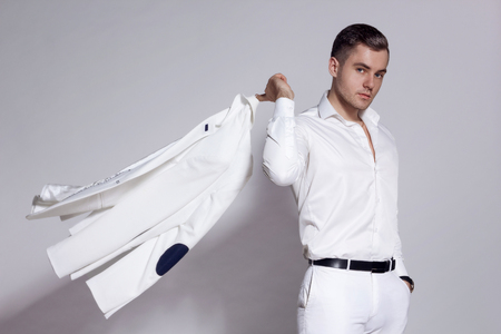 man in a white jacket on a white backgroundの写真素材