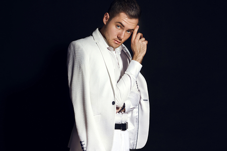 man in a white jacket on a black backgroundの写真素材