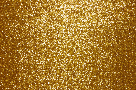 Sparkling golden sequin textile backgroundの写真素材