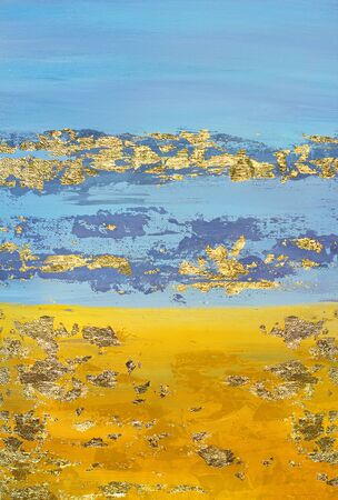gold paint on a blue backgroundの写真素材